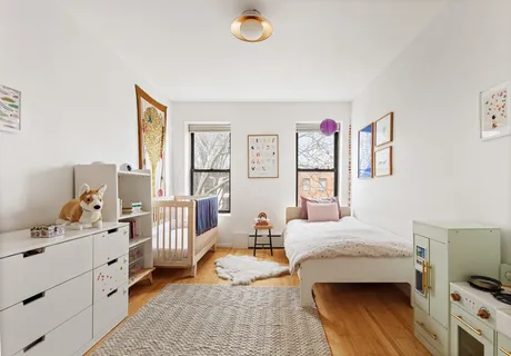 a bedroom with furniture and a window