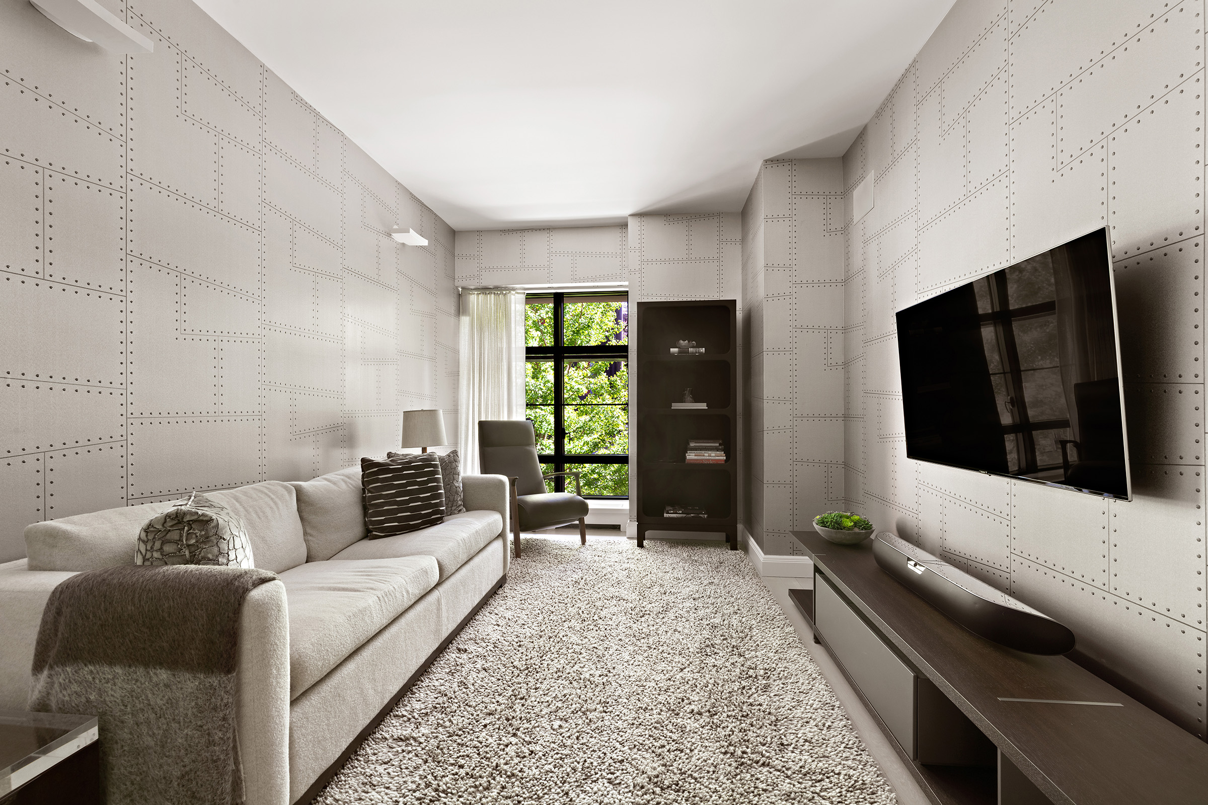 150 Charles Street, Unit M10 Manhattan, NY 10014 - Photo 17 of 34 a living room with furniture and a flat screen tv