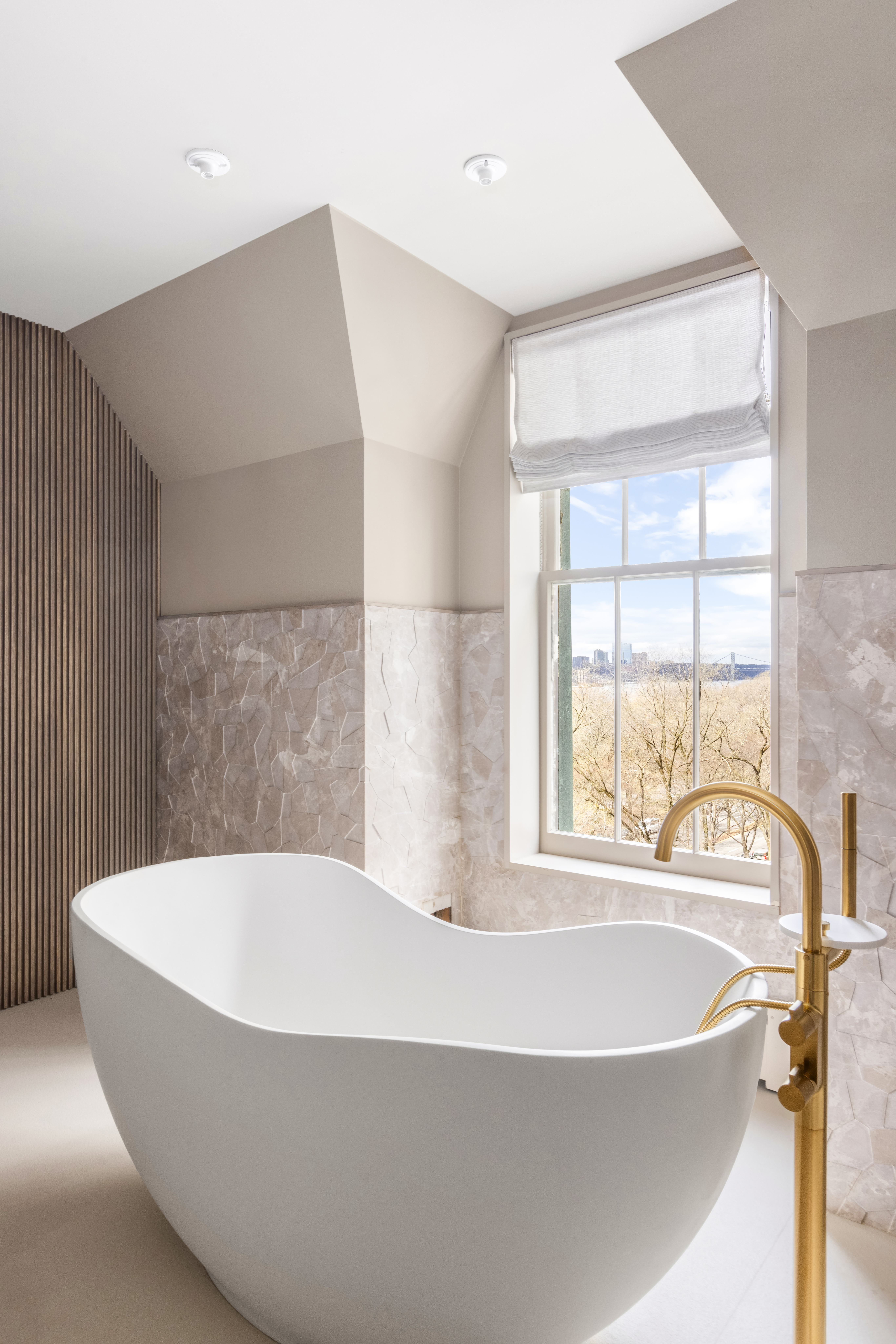 337 Riverside Drive Manhattan, NY 10025 - Photo 20 of 32 a white bath tub sitting in a bathroom