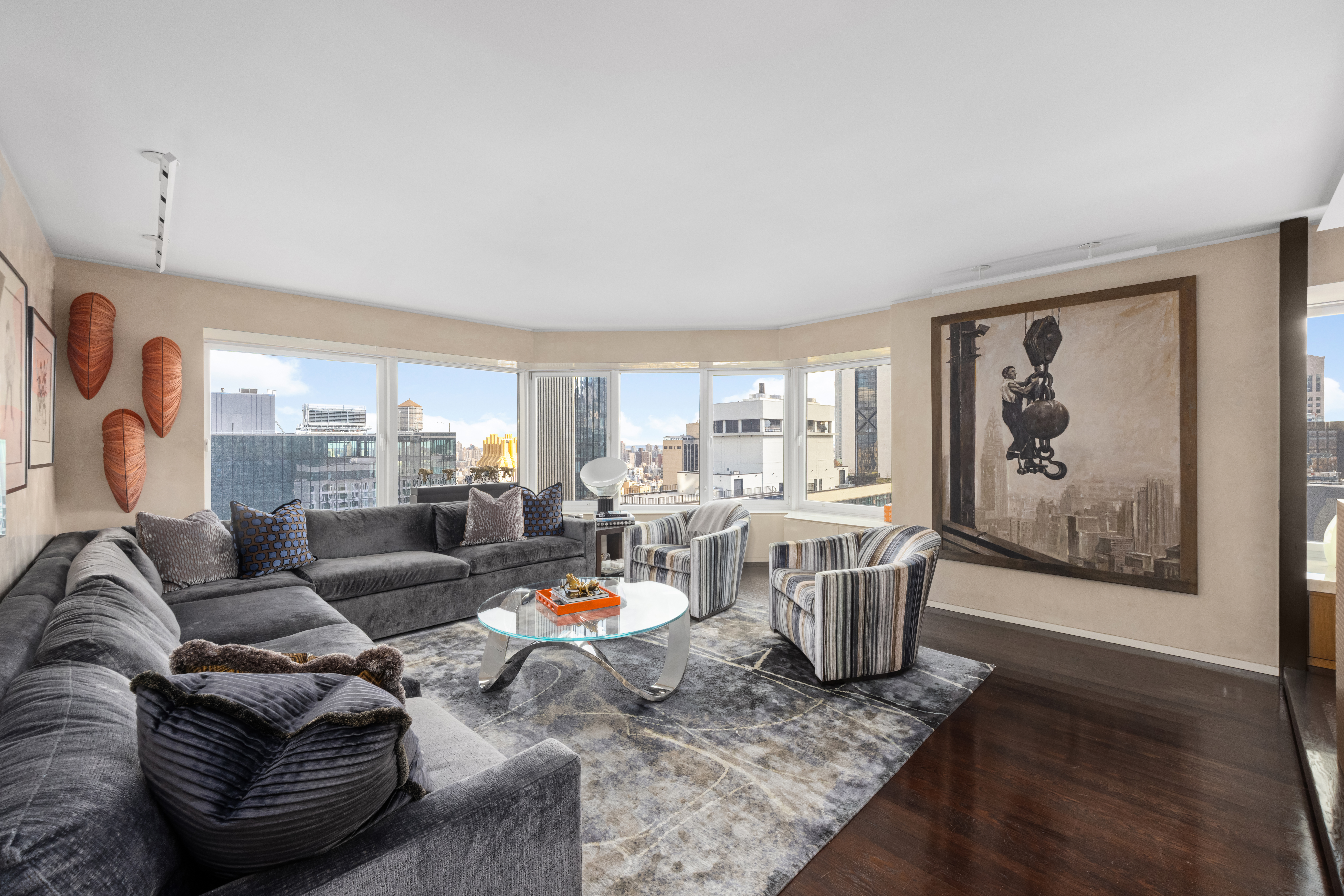 150 West 56th Street, Unit 3901 Manhattan, NY 10019 - Photo 2 of 25 a living room with furniture and a large window