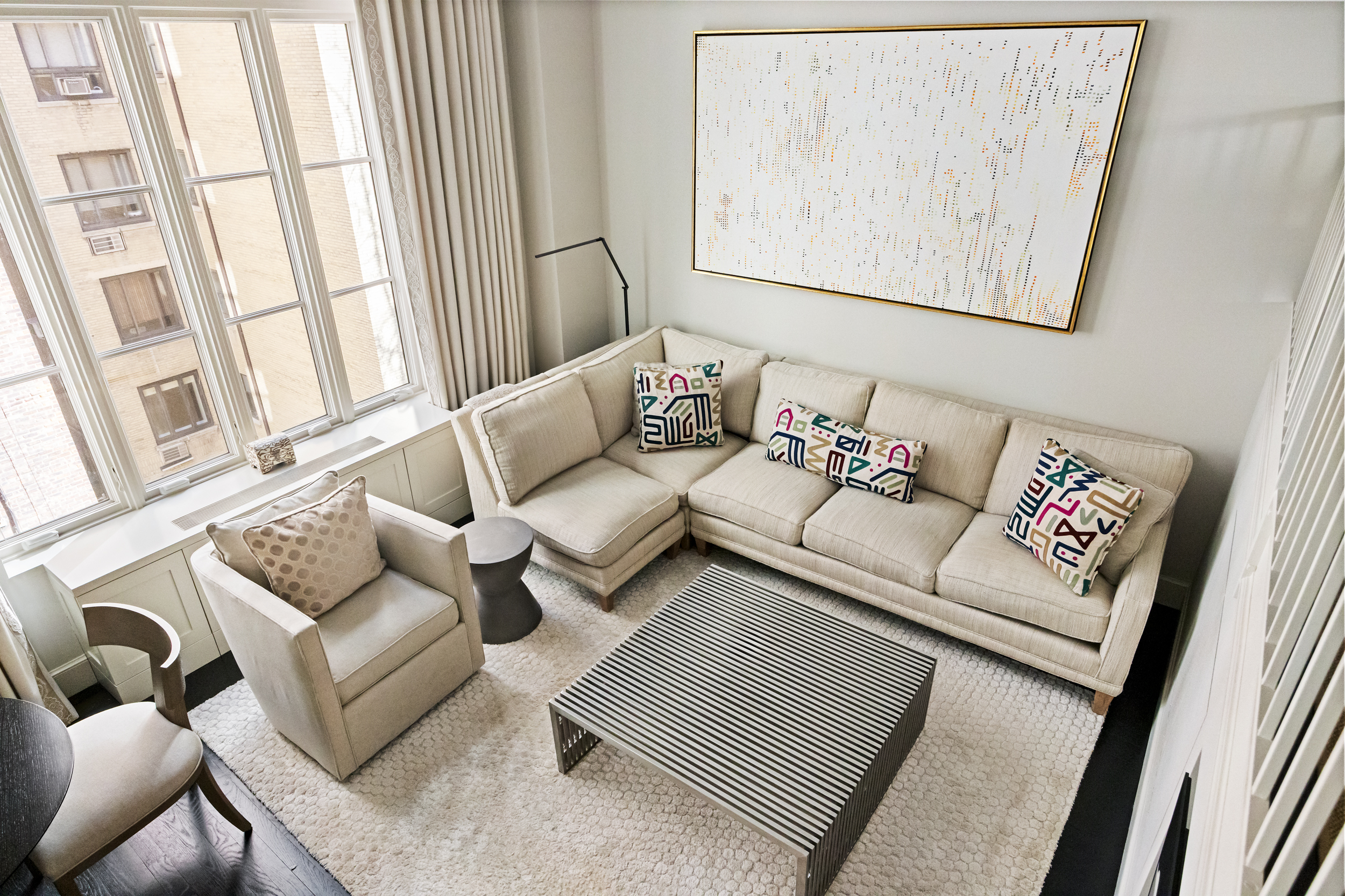 169 East 78th Street, Unit 7C Manhattan, NY 10075 - Photo 23 of 30 a living room with furniture and a large window