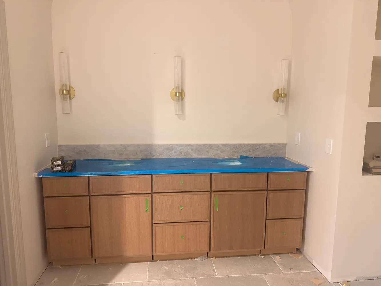 a bathroom with a sink and cabinets