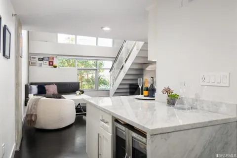 a kitchen with stainless steel appliances a stove microwave and cabinets