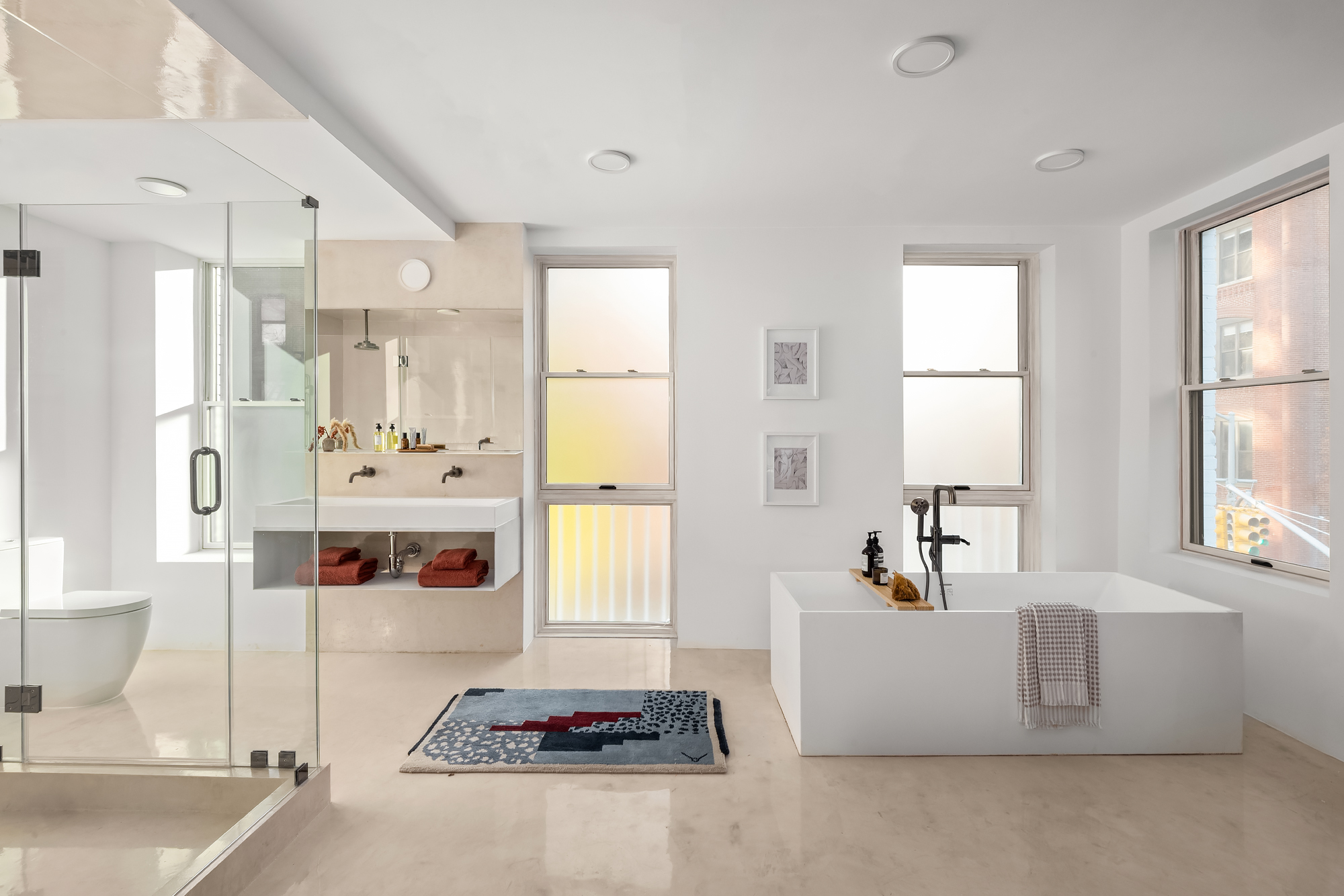 61 South 4th Street Brooklyn, NY 11249 - Photo 14 of 29 a bathroom with a tub sink and mirror
