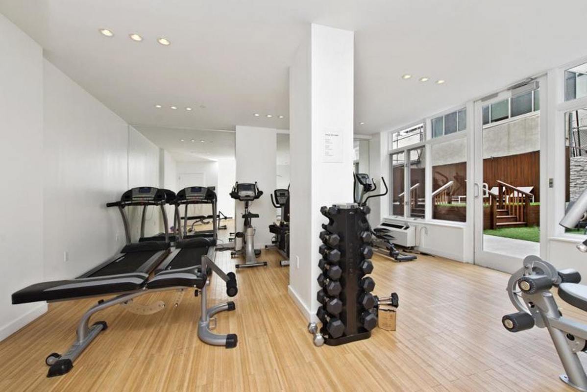 333 East 109th Street, Unit 2A Manhattan, NY 10029 - Photo 8 of 13 a view of a room with gym equipment