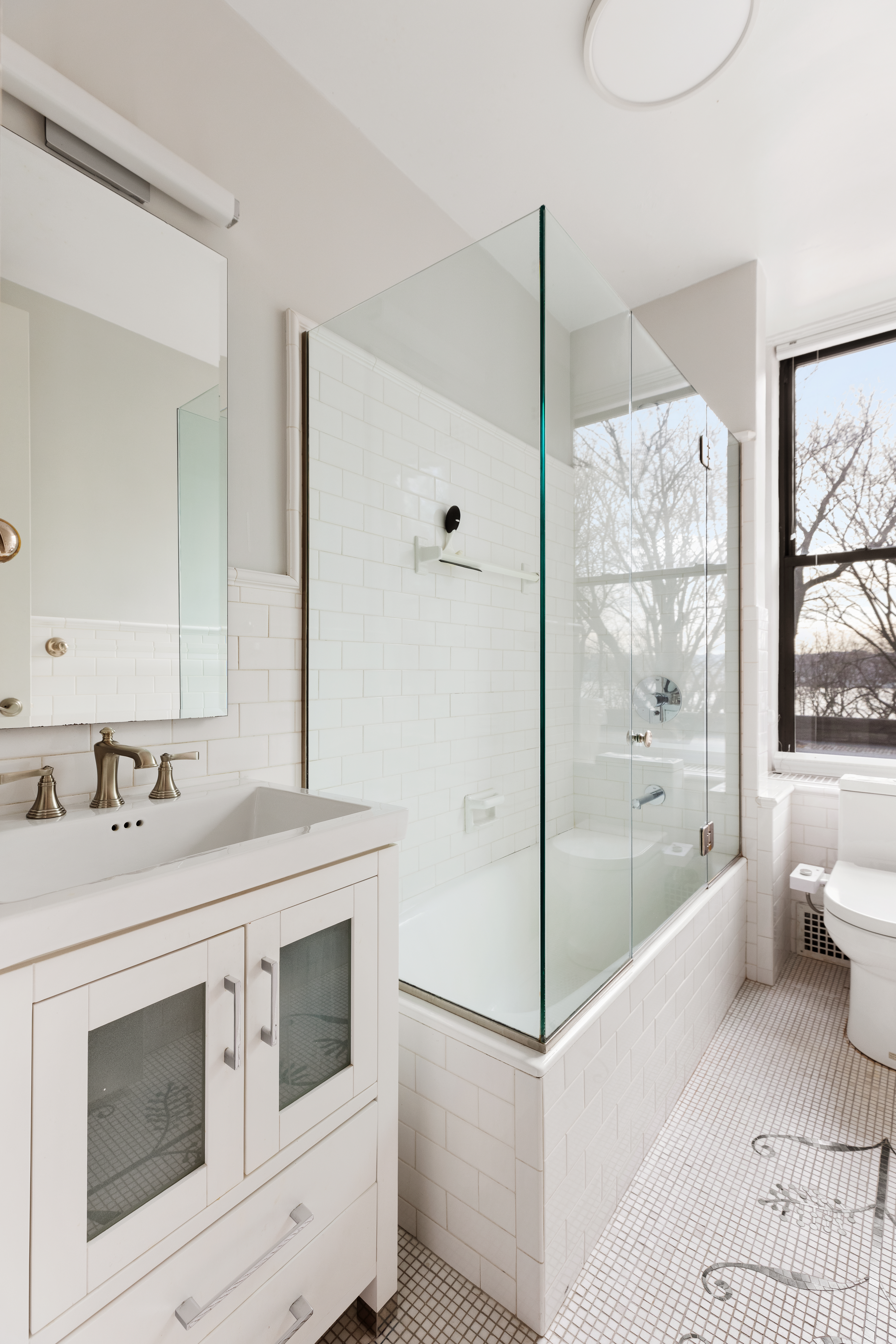 137 Riverside Drive, Unit 2D Manhattan, NY 10024 - Photo 16 of 20 a bathroom with a sink a toilet and shower