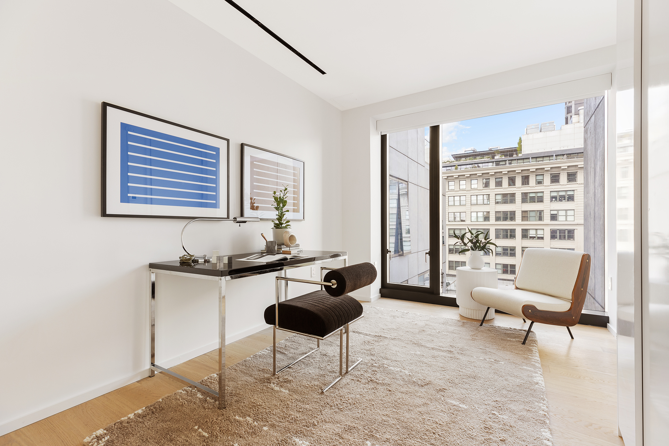 98 Front Street, Unit PH3G Brooklyn, NY 11201 - Photo 7 of 12 a living room with furniture and a large window
