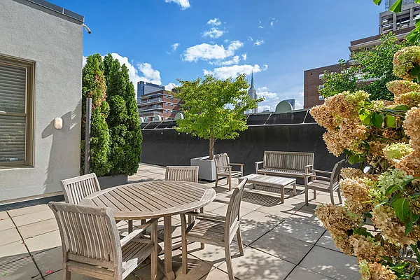 263 9th Avenue, Unit 7A Manhattan, NY 10001 - Photo 8 of 11 a view of a backyard with furniture