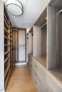 a view of walk in closet and bedroom view