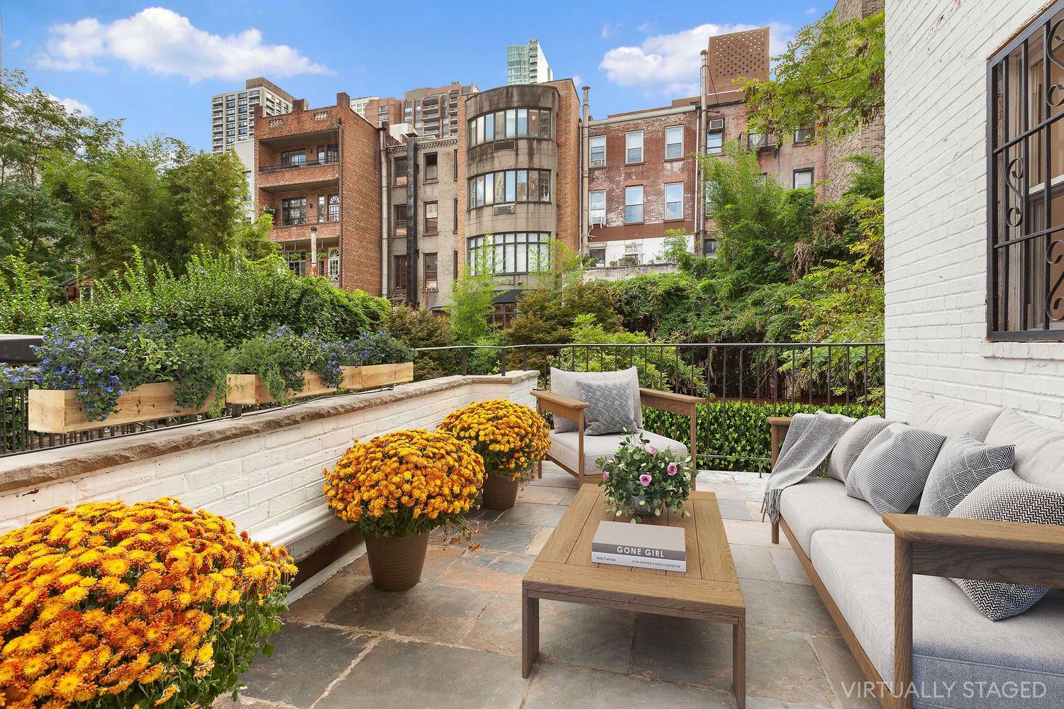 222 East 61st Street Manhattan, NY 10065 - Photo 8 of 28 a view of a patio with couches table and chairs and potted plants