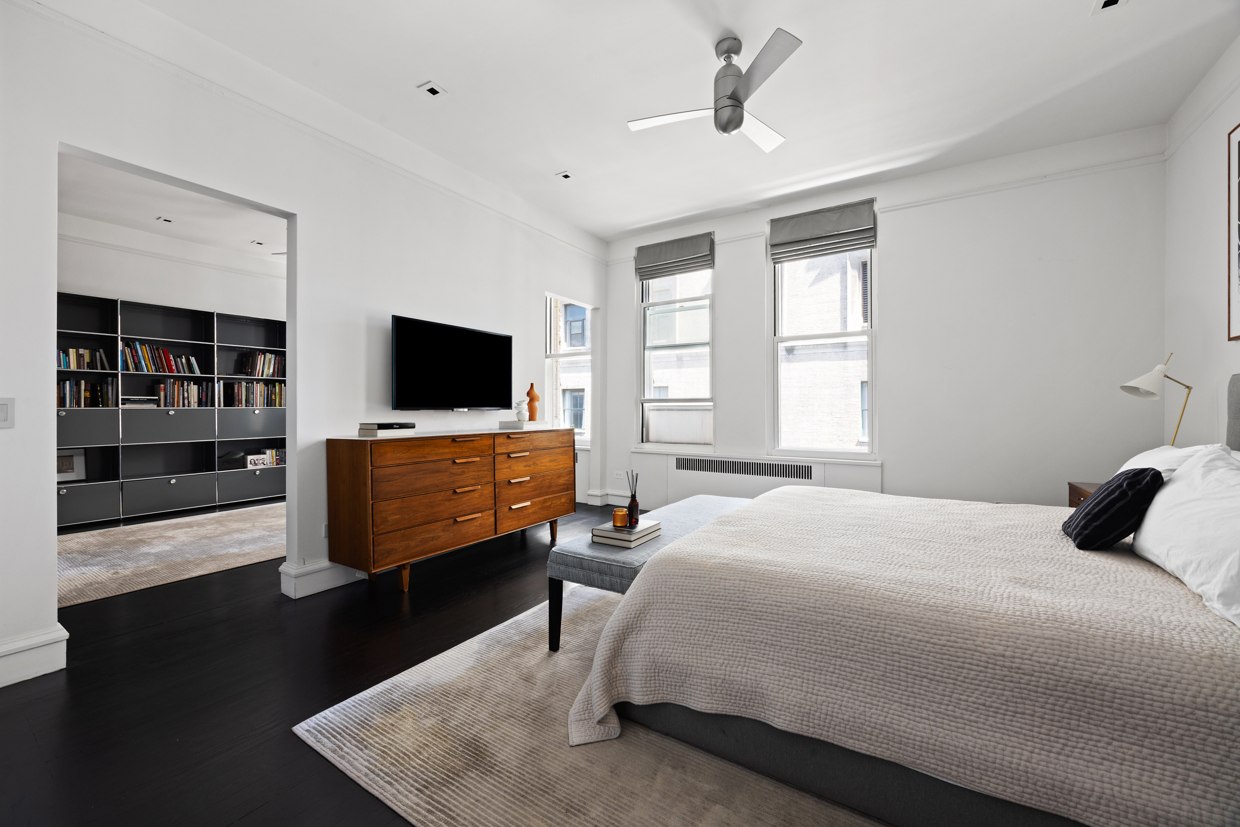 180 West 58th Street, Unit 11A Manhattan, NY 10019 - Photo 10 of 17 a bedroom with bed tv and window