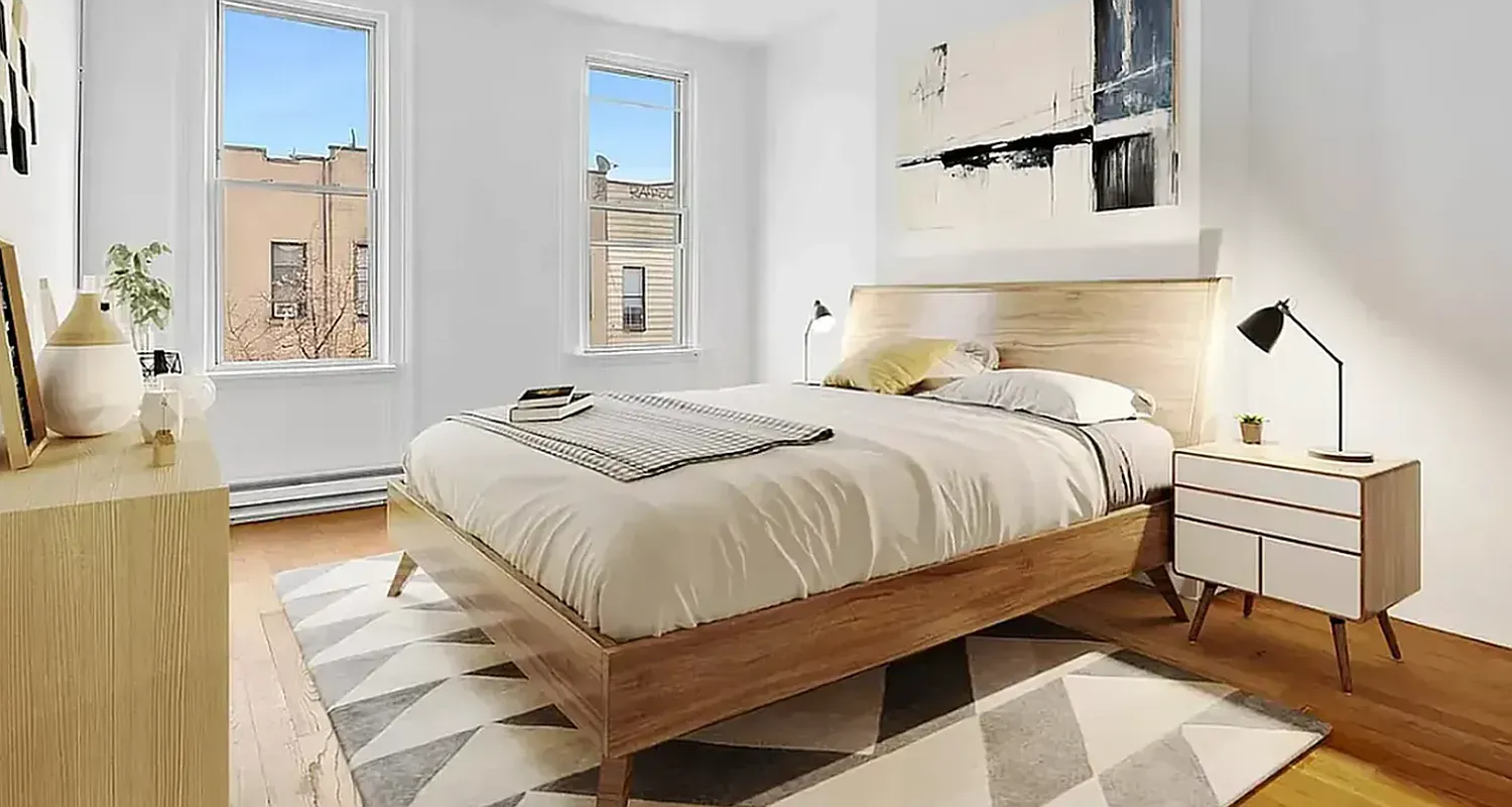 a bedroom with a bed and window