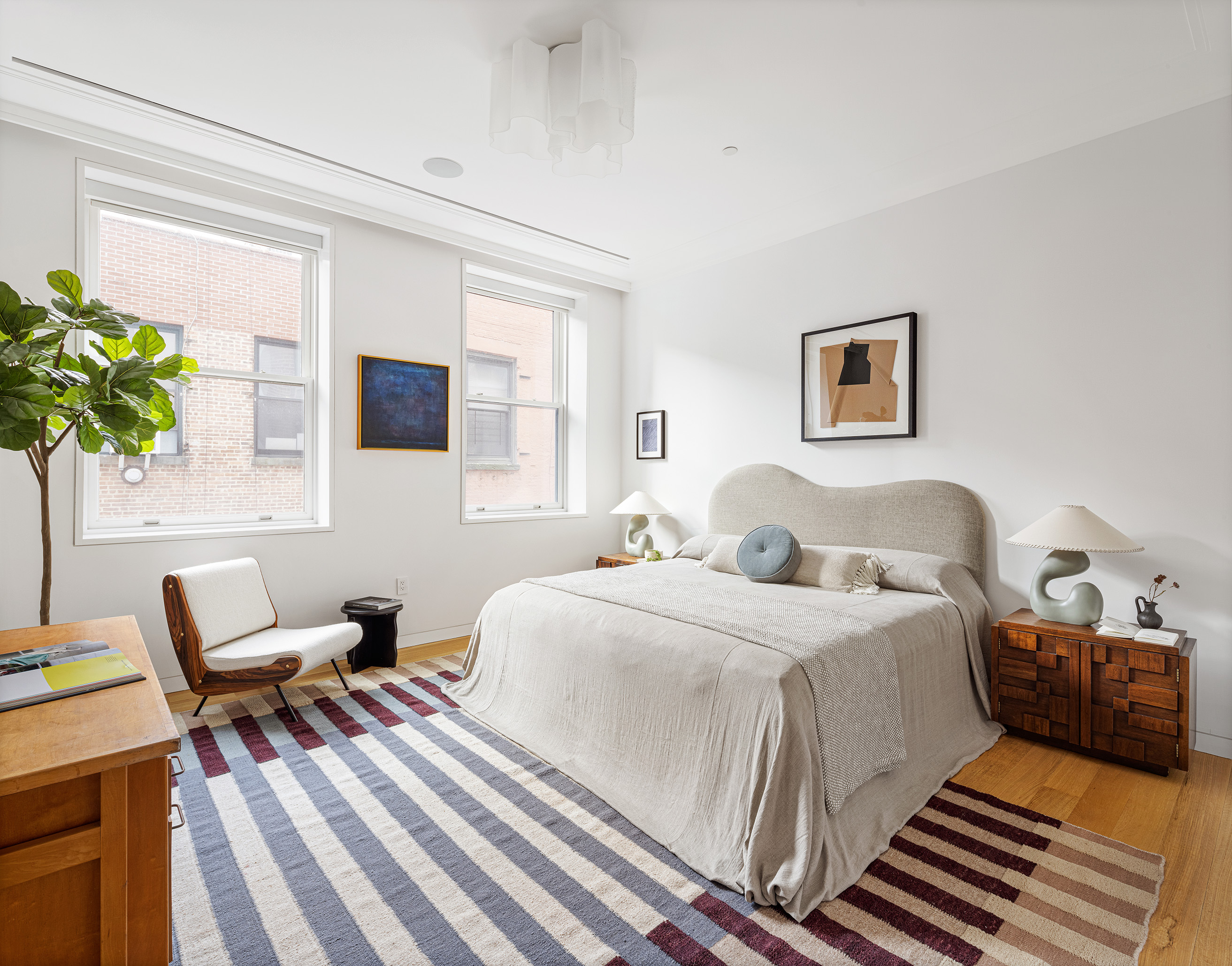 7 Harrison Street, Unit 5S Manhattan, NY 10013 - Photo 13 of 21 a bedroom with a bed and a potted plant