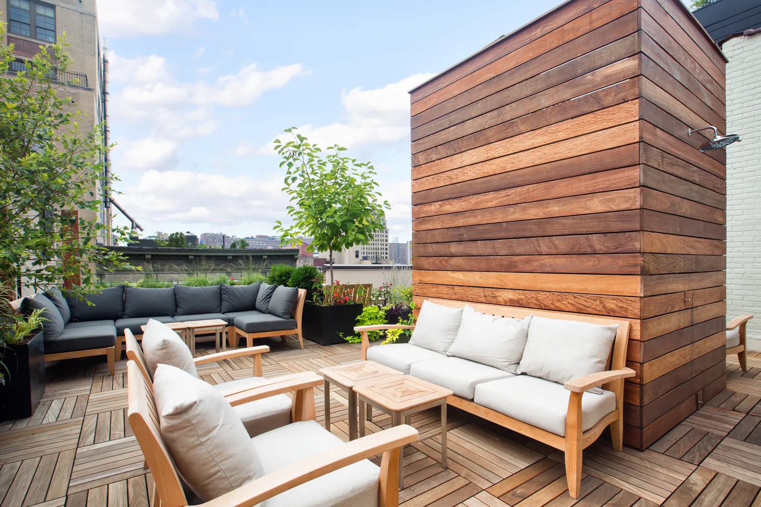 a view of a patio with couches chairs and a fire pit