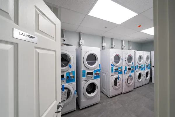 a bathroom with a sink mirror vanity and toilet