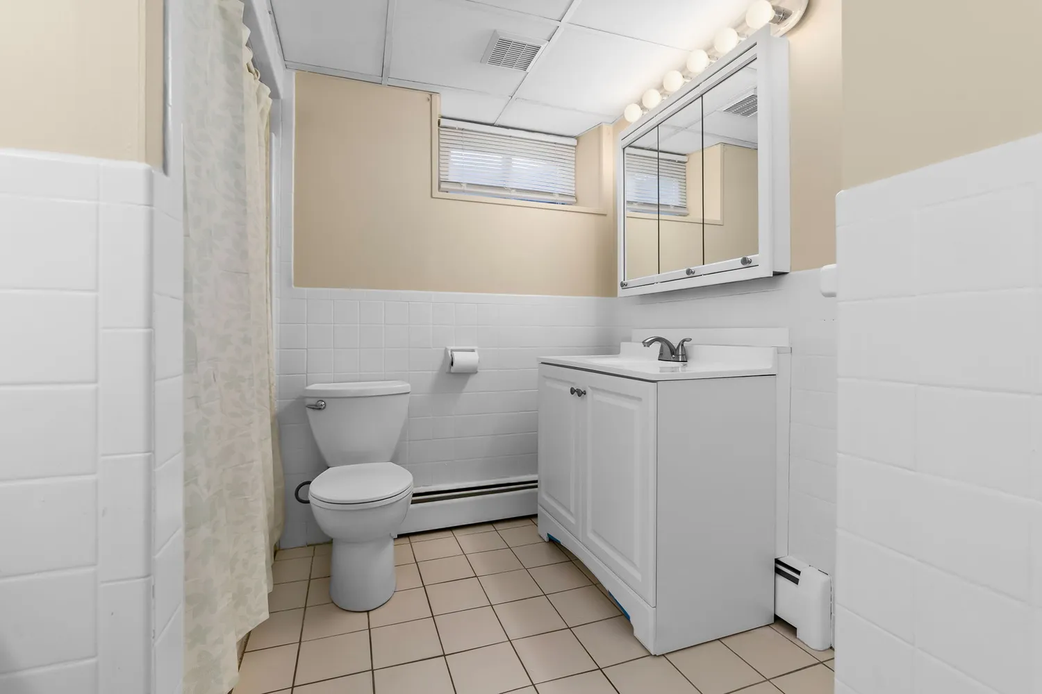 a bathroom with a sink toilet and vanity