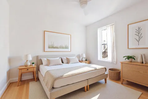 a bedroom with a bed and a couch