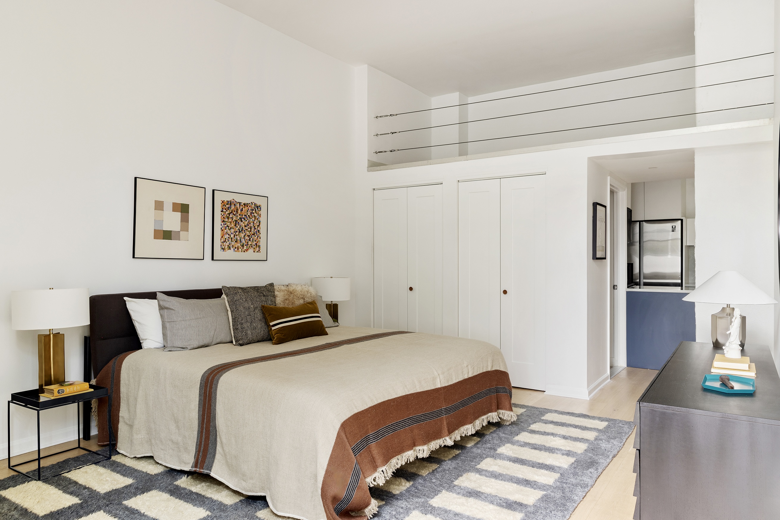 720 Greenwich Street, Unit 1F New York, NY 10014 - Photo 7 of 16 a bedroom with a bed and a flat screen tv