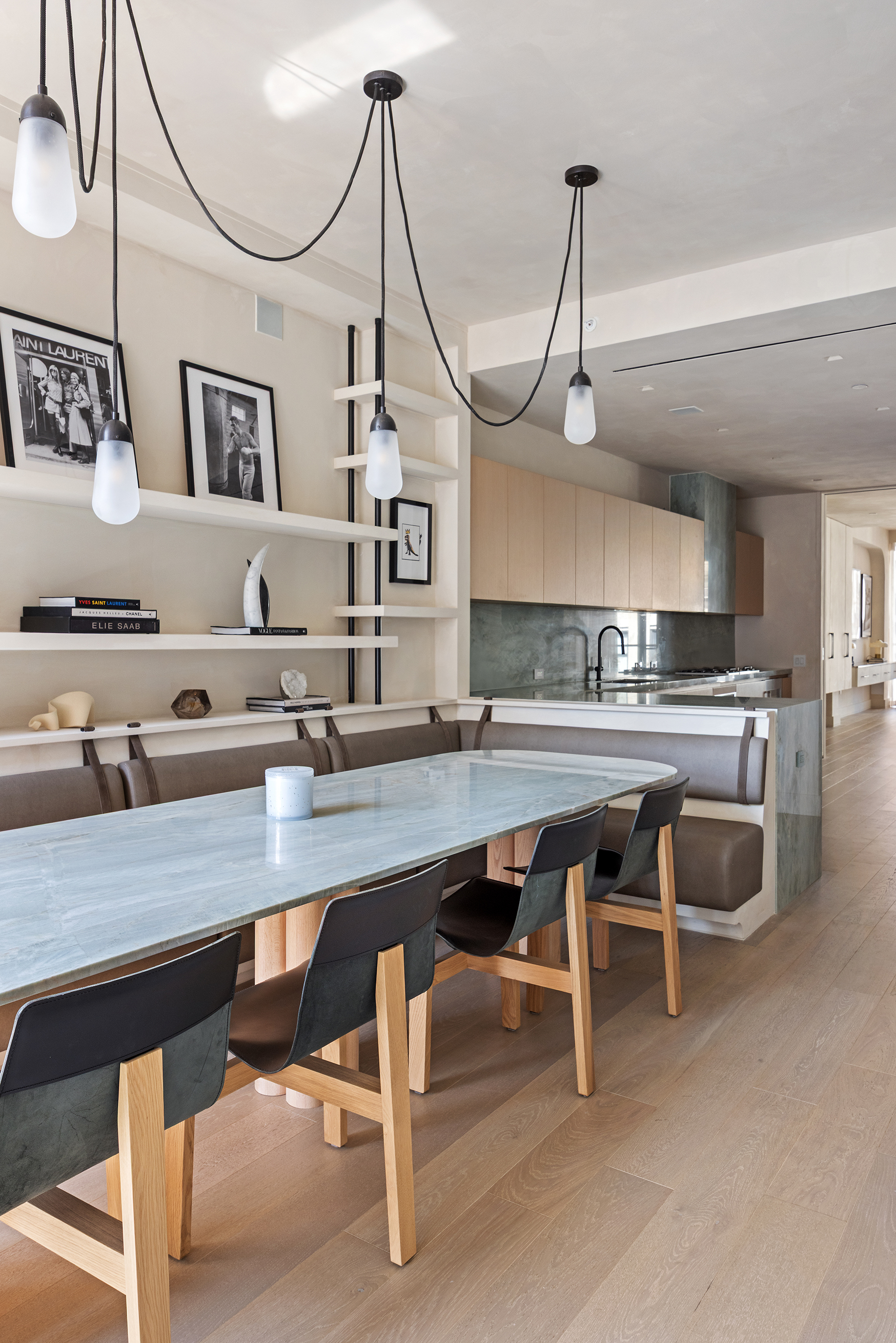 1 Great Jones Alley, Unit 10 Manhattan, NY 10012 - Photo 12 of 41 a room with stainless steel appliances kitchen island granite countertop a table chairs in it and wooden floors