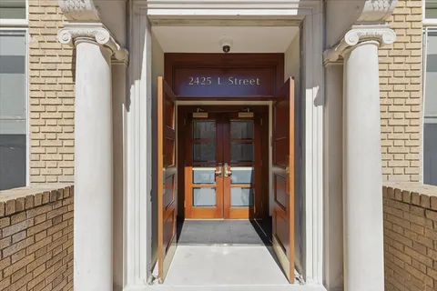 a view of pathway with a yard