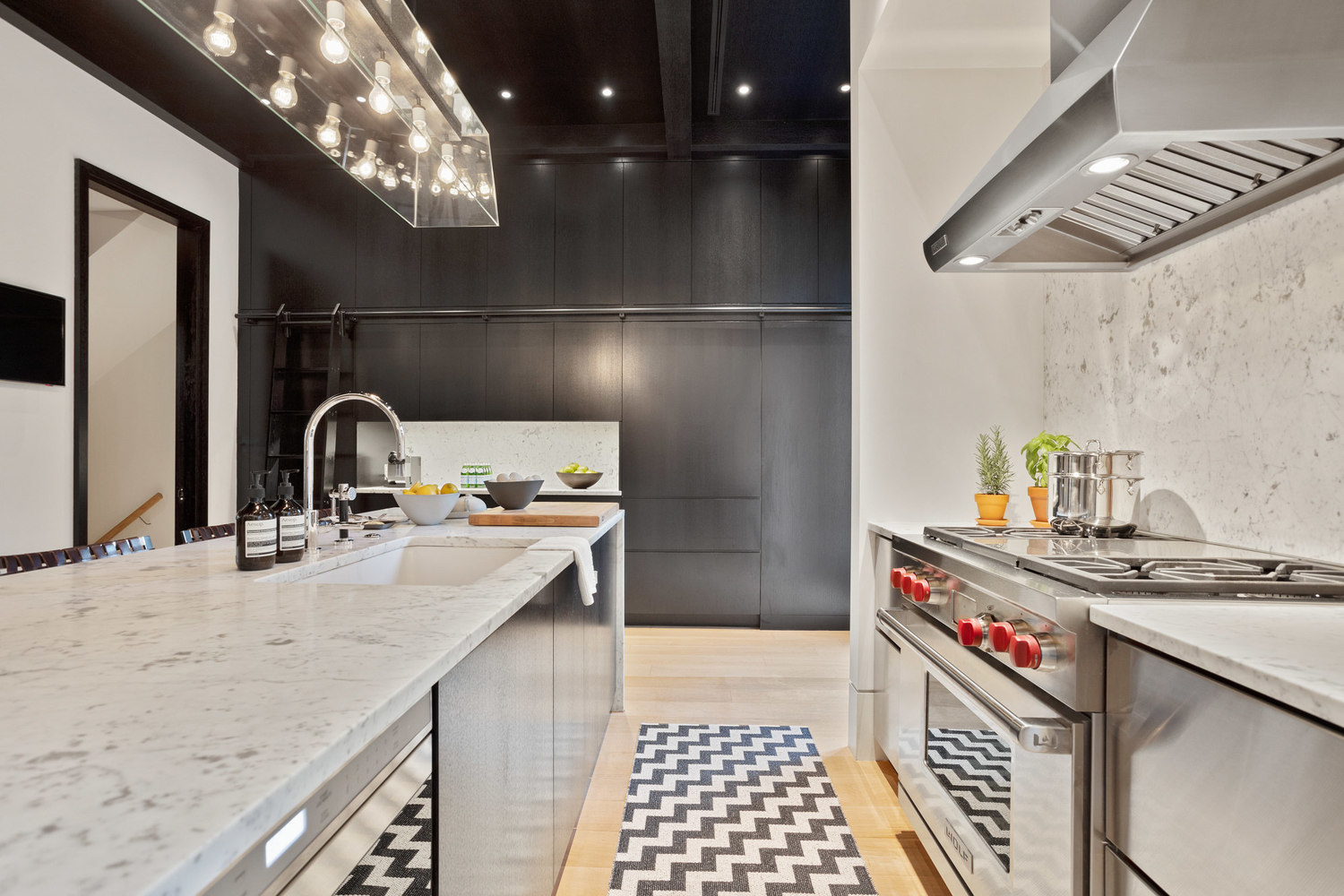 315 Adelphi Street Brooklyn, NY 11205 - Photo 8 of 31 a kitchen with stainless steel appliances granite countertop a sink and cabinets