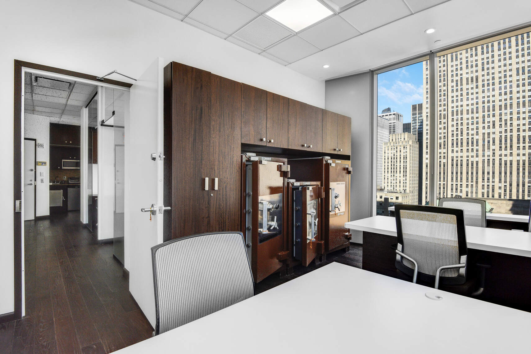 50 West 47th Street, Unit Undisclosed Manhattan, NY 10036 - Photo 12 of 27 a bedroom with a bed and wooden floor