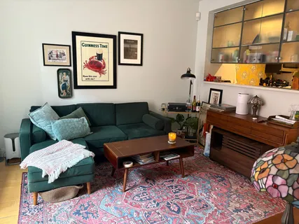 a living room with furniture and a window