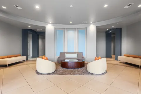 a bathroom with a glass shower door and a bathtub