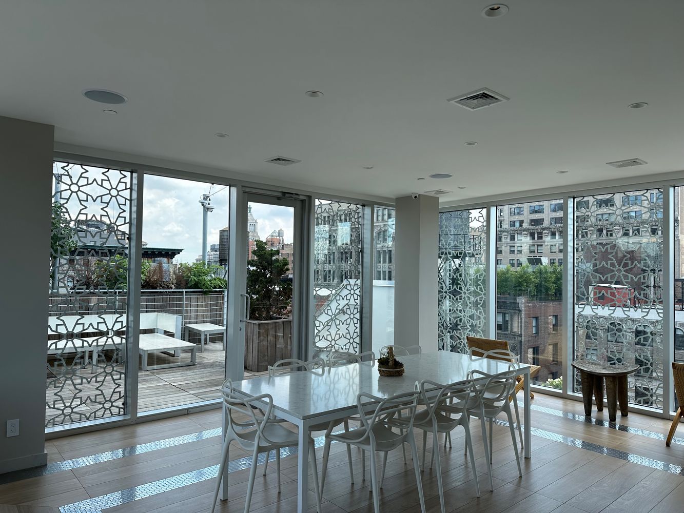 16 West 19th Street, Unit 8B Manhattan, NY 10011 - Photo 18 of 19 a view of a city from a dining room with furniture window and wooden floor