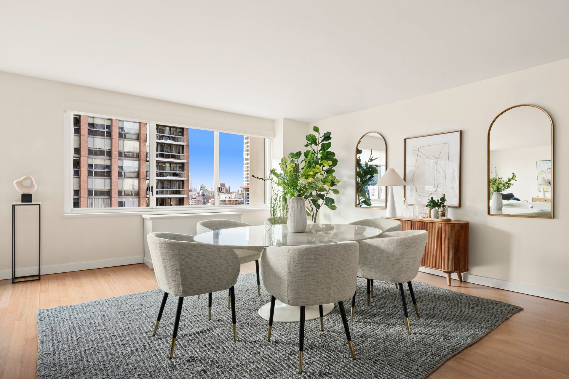 300 East 59th Street, Unit 2103 Manhattan, NY 10022 - Photo 2 of 14 a dining room with furniture and window