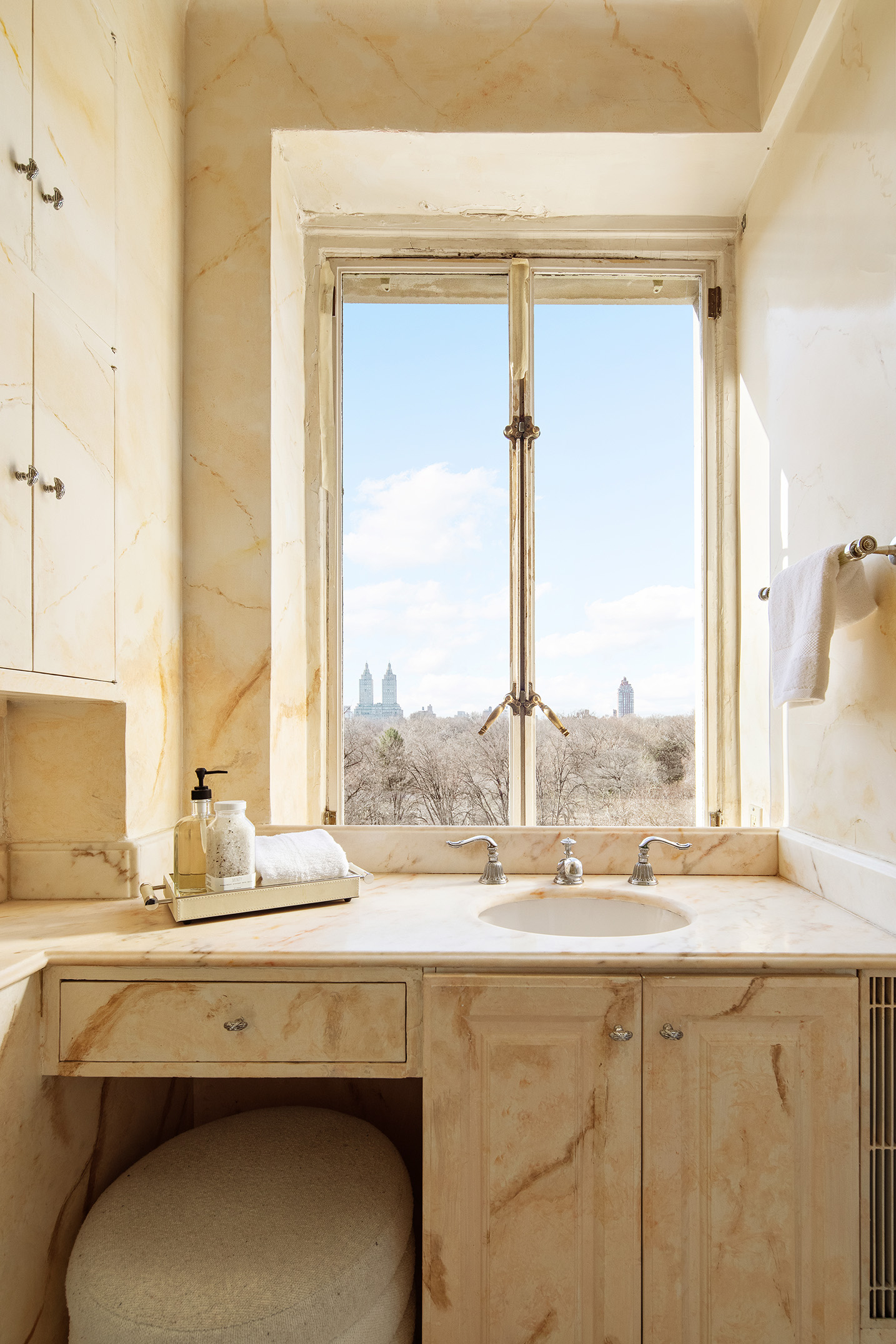 953 5th Avenue, Unit 7/8 Manhattan, NY 10075 - Photo 10 of 15 a bathroom with a sink window and a mirror