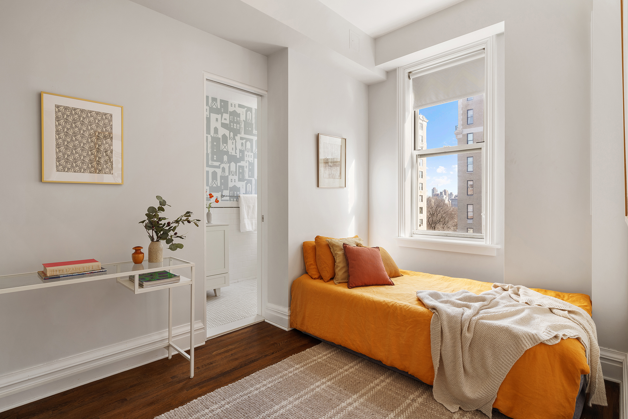 24 West 69th Street, Unit 9A Manhattan, NY 10023 - Photo 12 of 14 a bedroom with a bed and a window