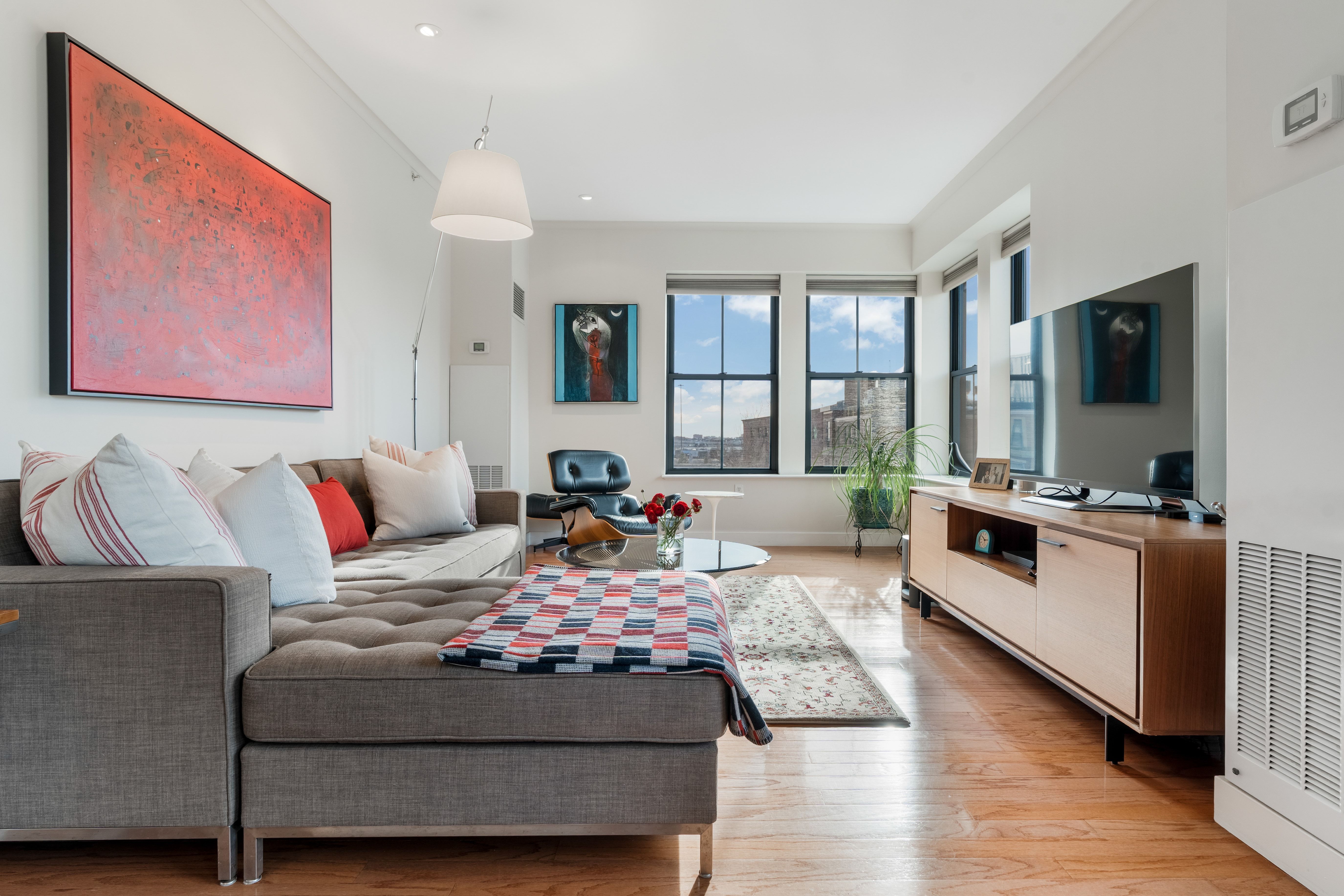 2 Rollins Street, Unit D601 Boston, MA 02118 - Photo 2 of 29 a living room with furniture and a flat screen tv