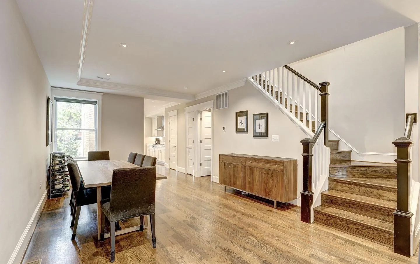 a kitchen with stainless steel appliances granite countertop a refrigerator a stove and a sink