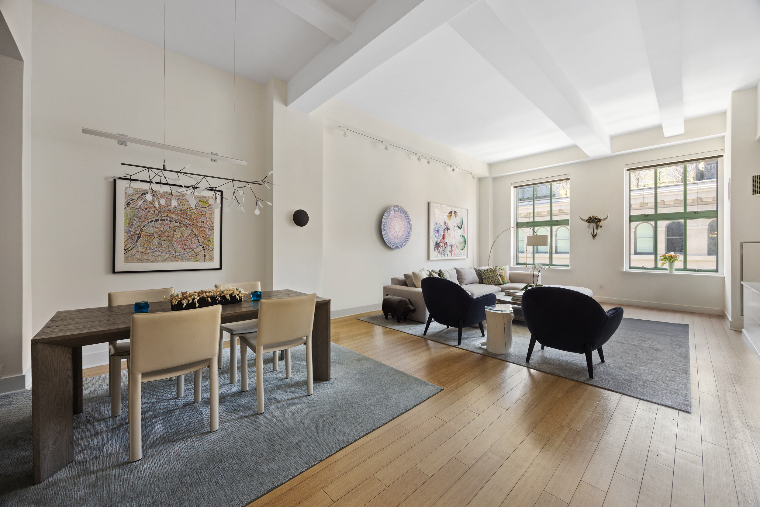 415 Greenwich Street, Unit 5D Manhattan, NY 10013 - Photo 2 of 16 a living room with furniture and wooden floor
