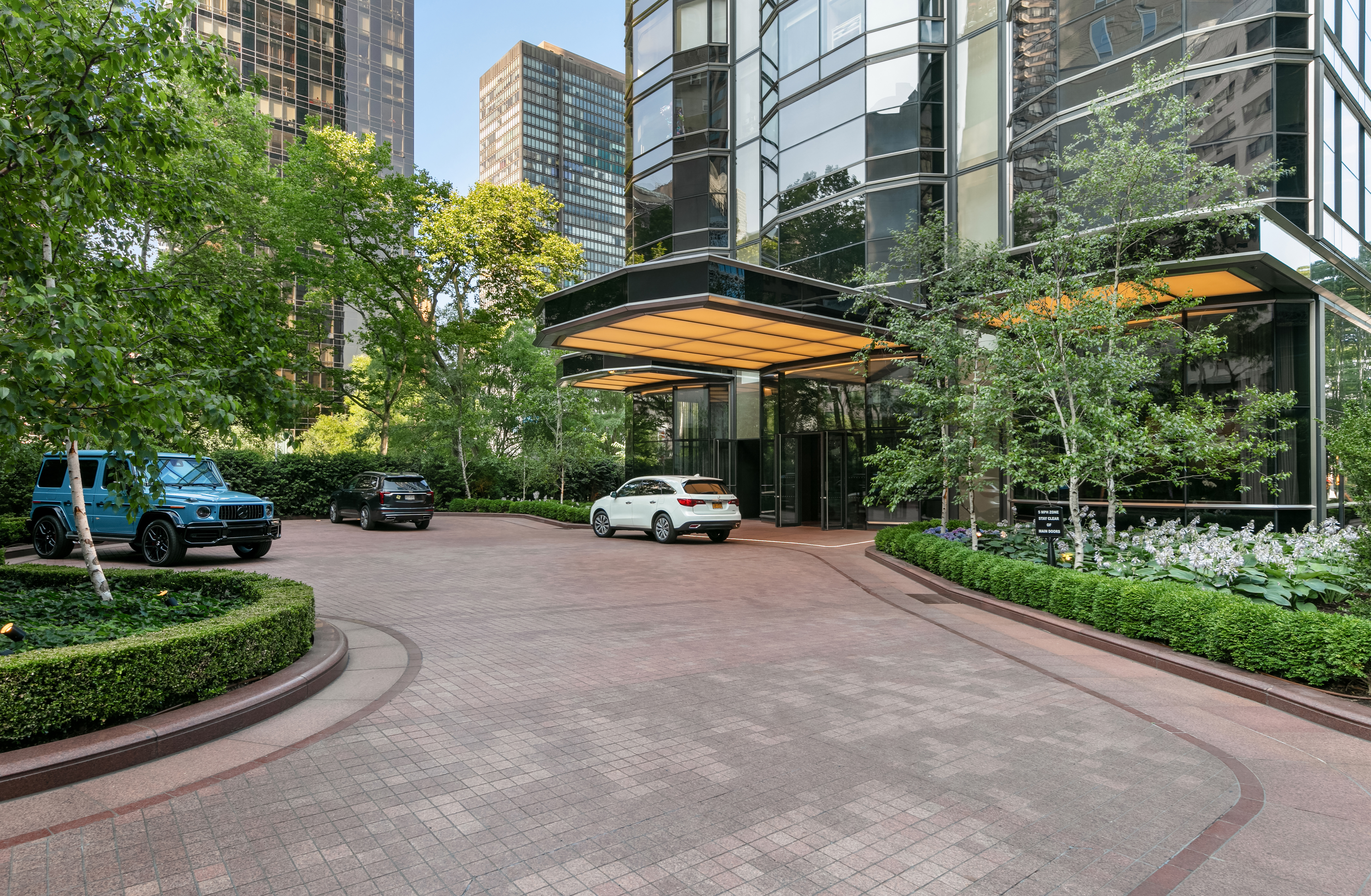 50 United Nations Plaza, Unit 6C Manhattan, NY 10017 - Photo 13 of 15 a view of a street with a bench and trees