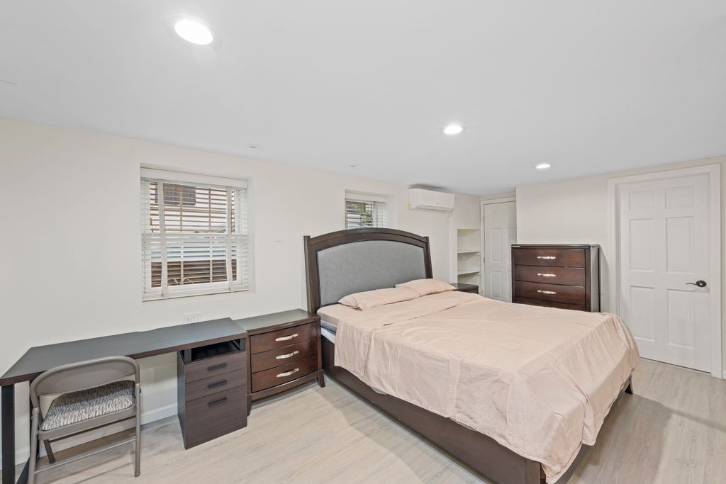 79 Sparkill Avenue Staten Island, NY 10304 - Photo 22 of 32 a bedroom with a bed and a dresser