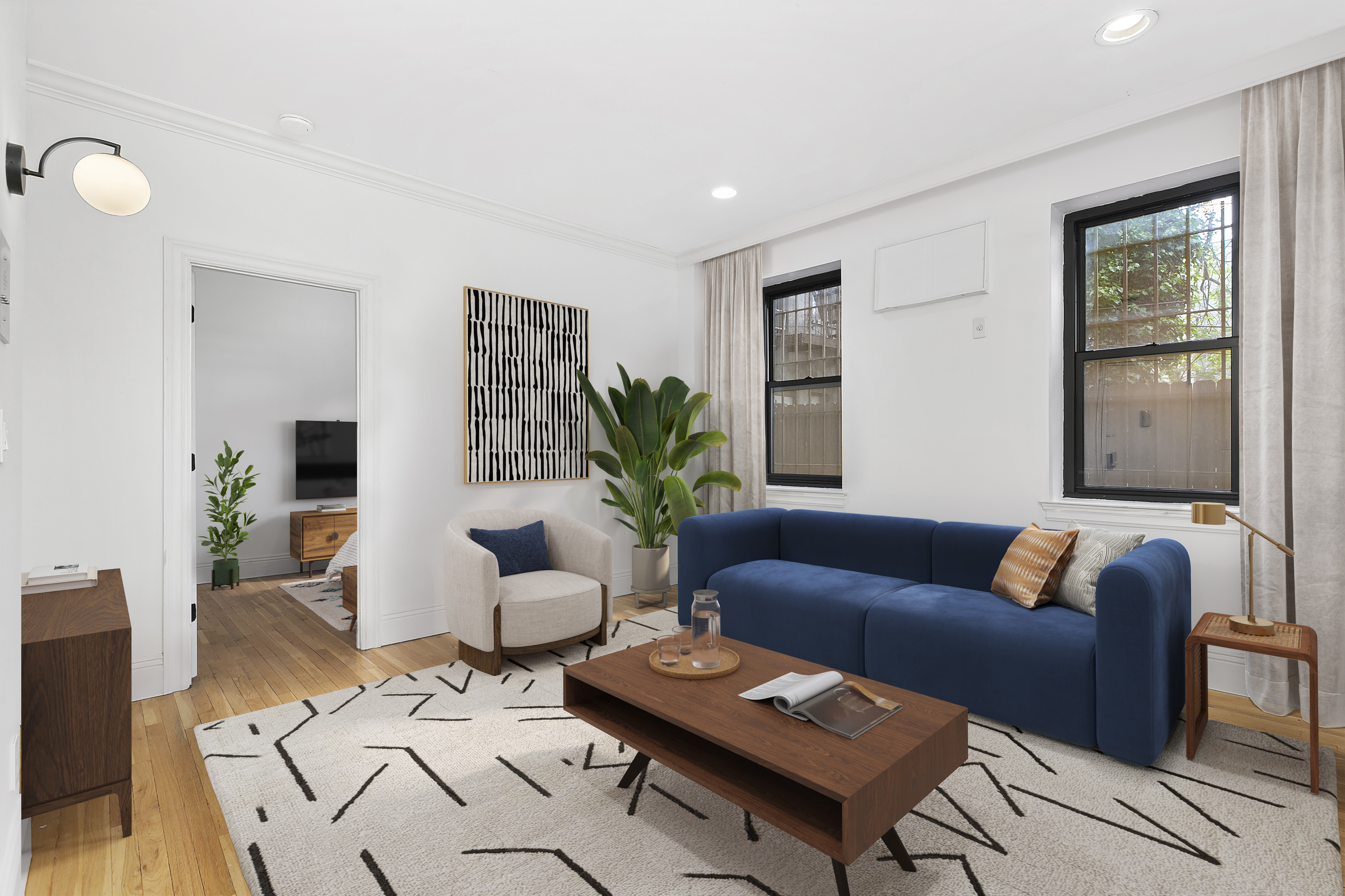 a living room with furniture potted plant and window