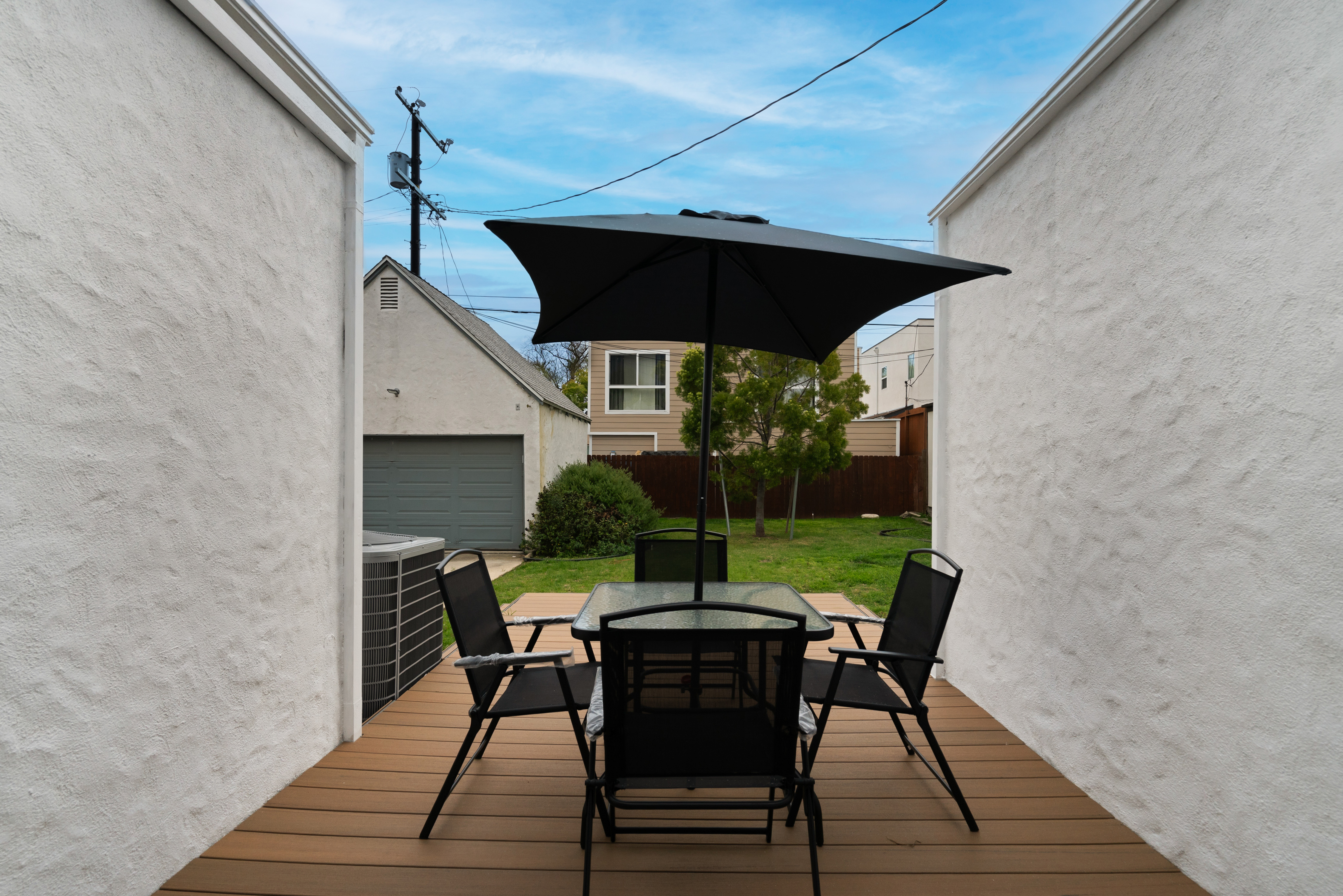 8832 Horner Street Los Angeles, CA 90035 - Photo 22 of 24 a view of an outdoor sitting area with furniture and umbrella