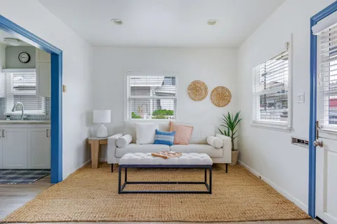 a living room with furniture and window