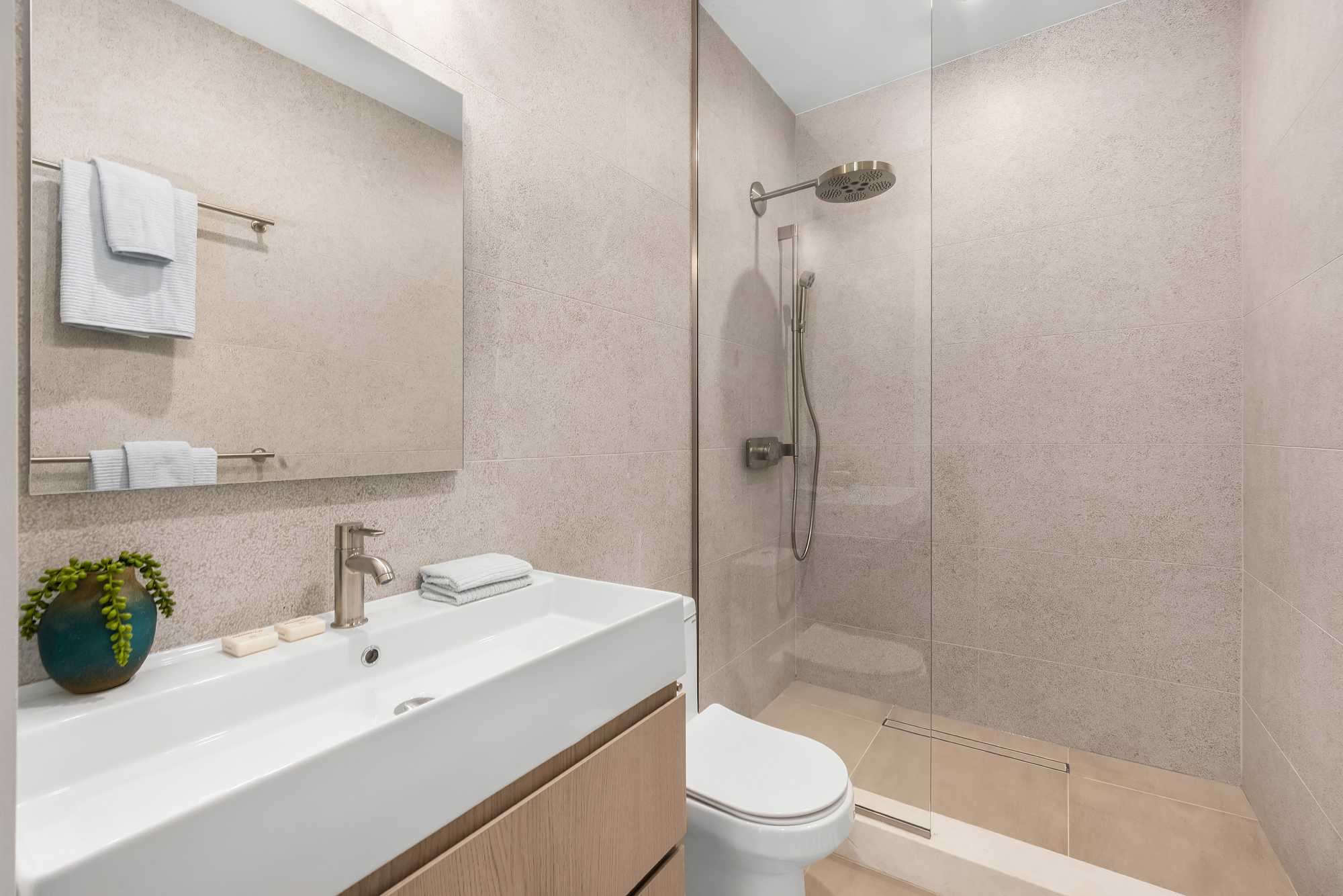 53 West 85th Street Manhattan, NY 10024 - Photo 30 of 37 a bathroom with a sink toilet and shower