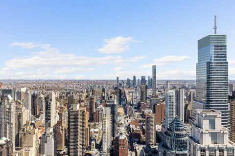 a view of a city with tall buildings