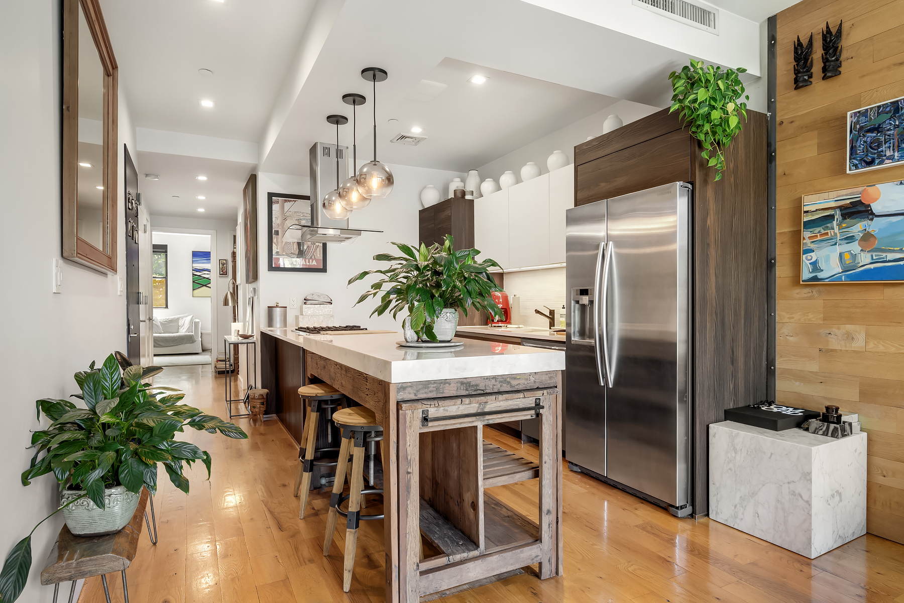 26 Eldert Street, Unit 4 Brooklyn, NY 11207 - Photo 3 of 10 a kitchen with refrigerator and table