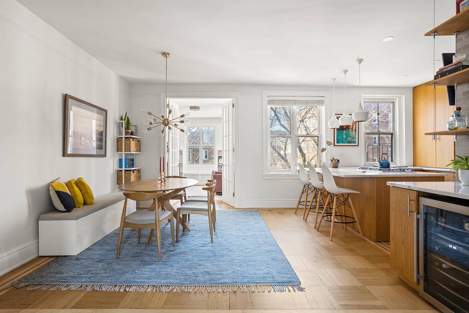 34-28 80th Street, Unit 41 Queens, NY 11372 - Photo 2 of 15 a living room with furniture a dining table and a piano table with wooden floor