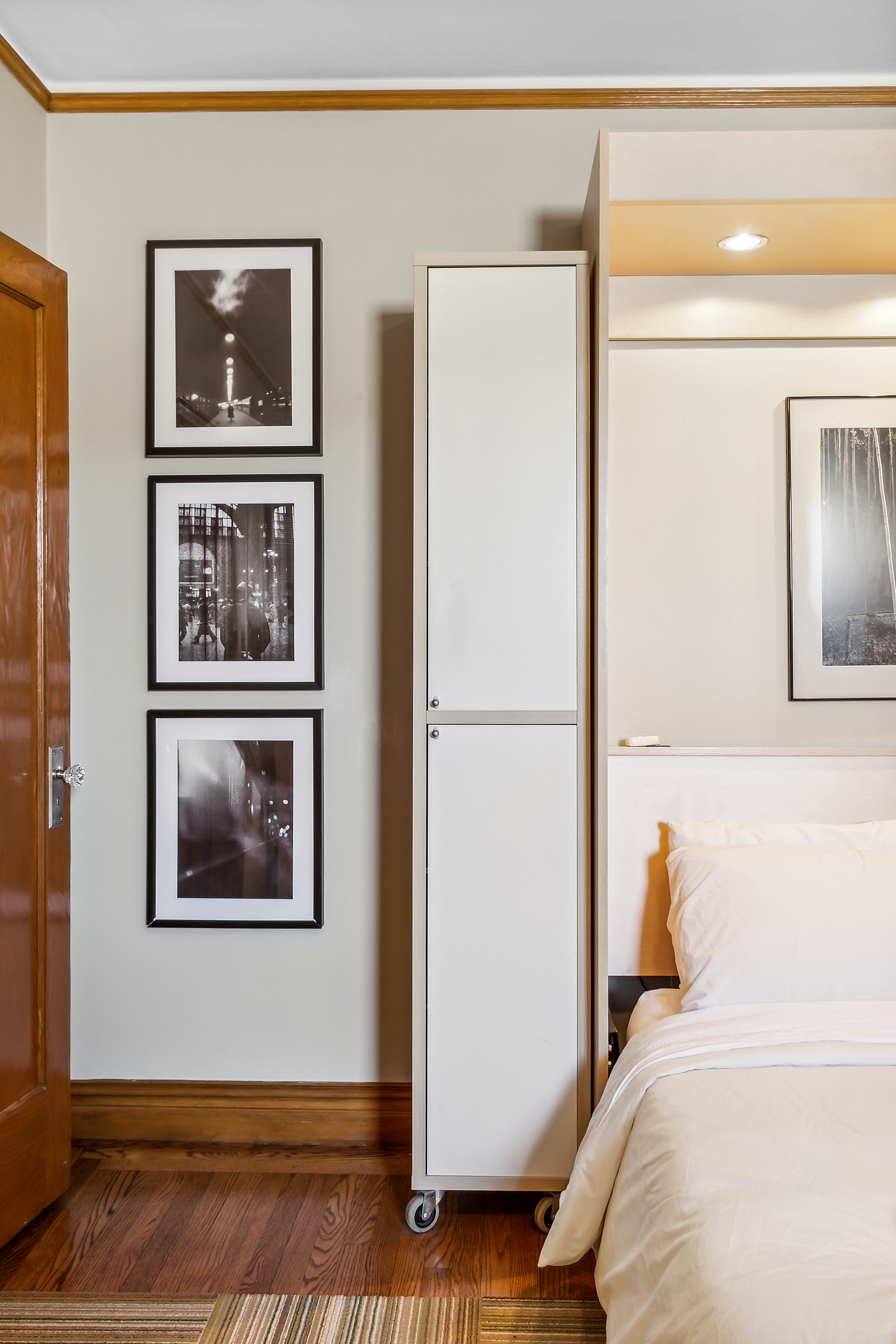 45 Park Terrace West, Unit 5A Manhattan, NY 10034 - Photo 9 of 22 a bedroom with a bed and a painting on the wall