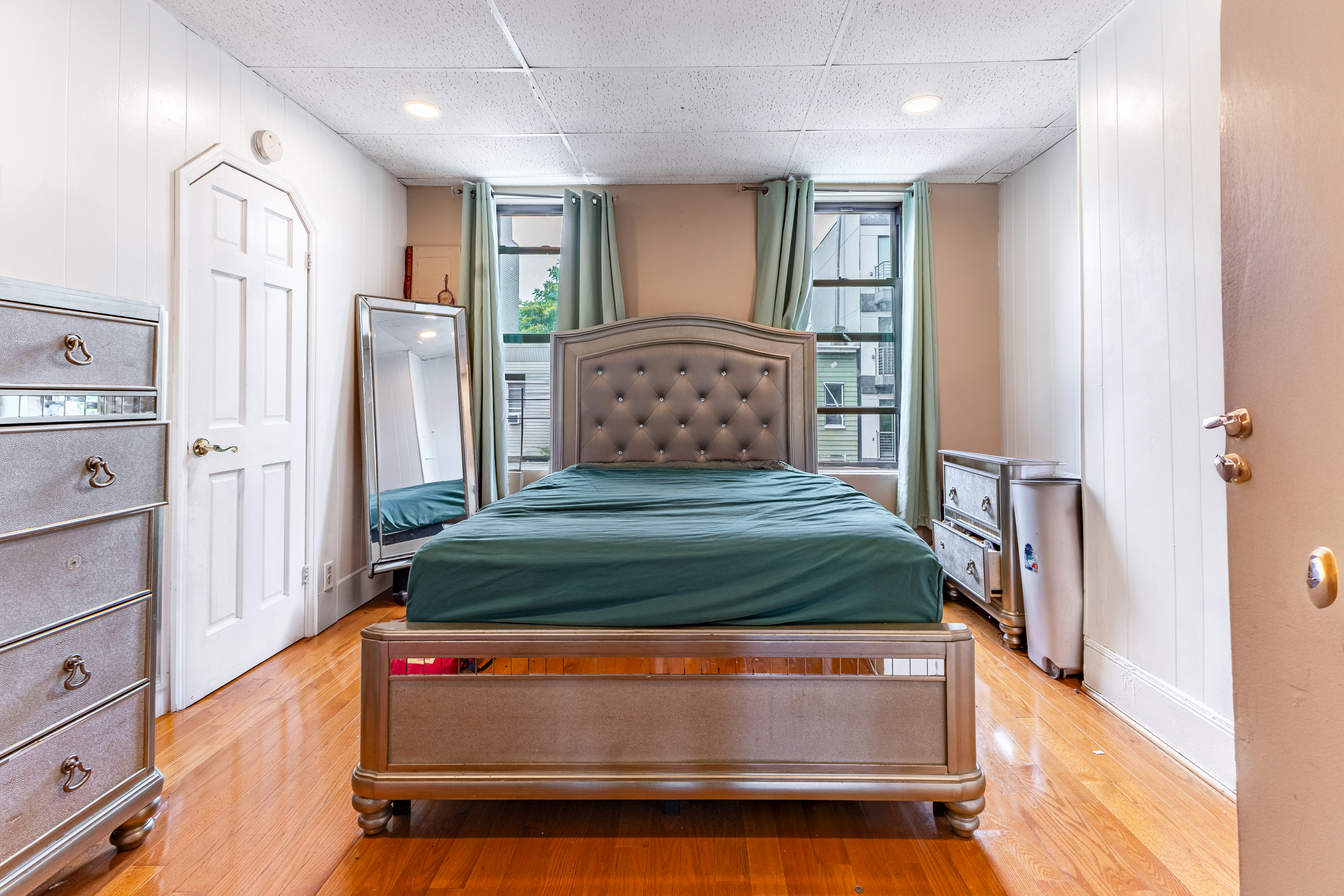 52 Himrod Street Brooklyn, NY 11221 - Photo 6 of 16 a bedroom with a bed and a dresser