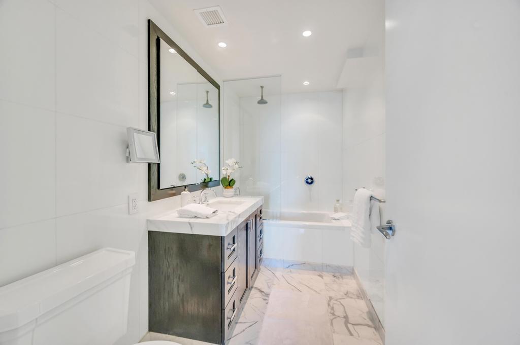 333 Rector Place, Unit PH6S Manhattan, NY 10280 - Photo 14 of 26 a bathroom with a sink a toilet and shower