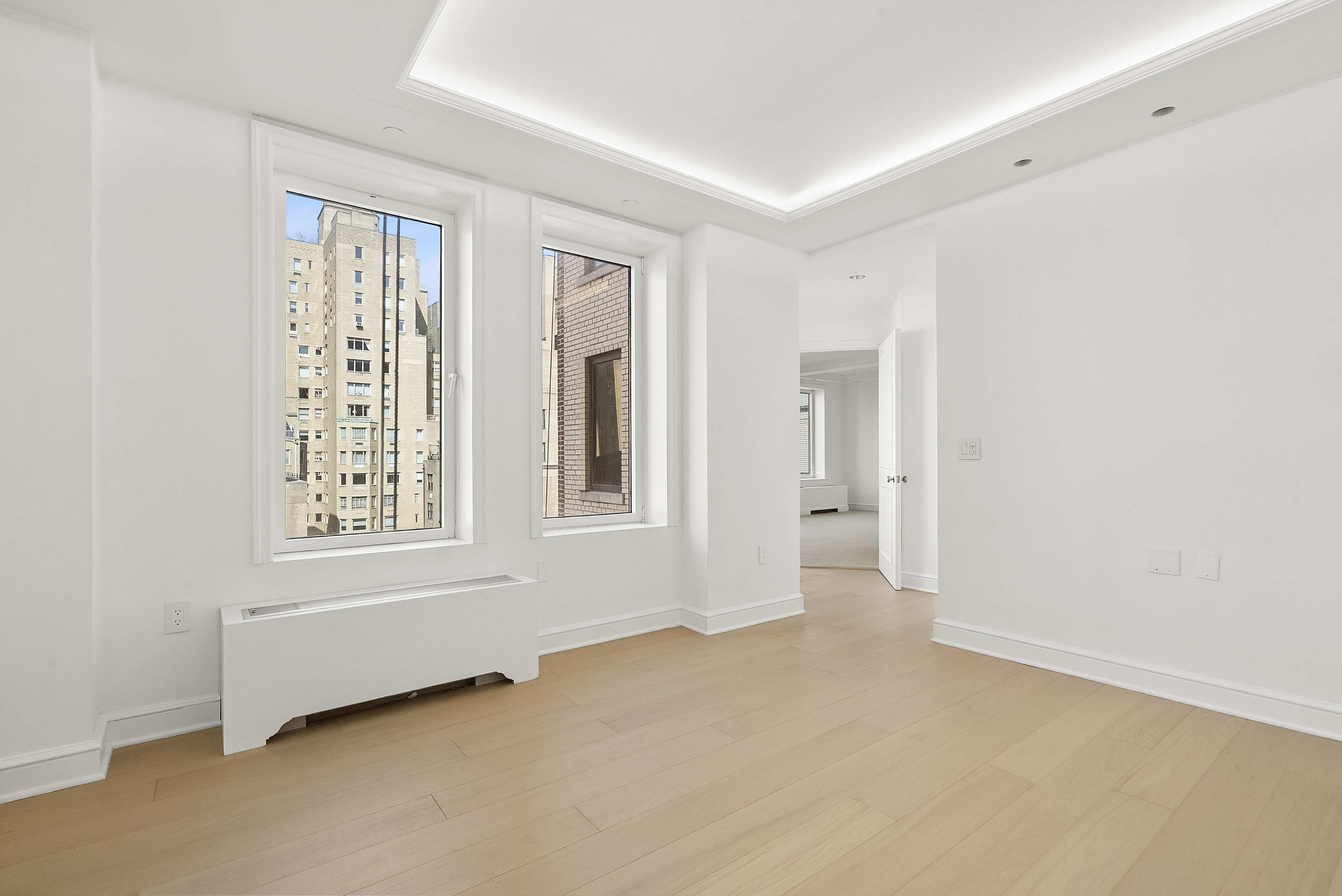 15 East 69th Street, Unit 10D Manhattan, NY 10021 - Photo 9 of 12 a view of an empty room with a window