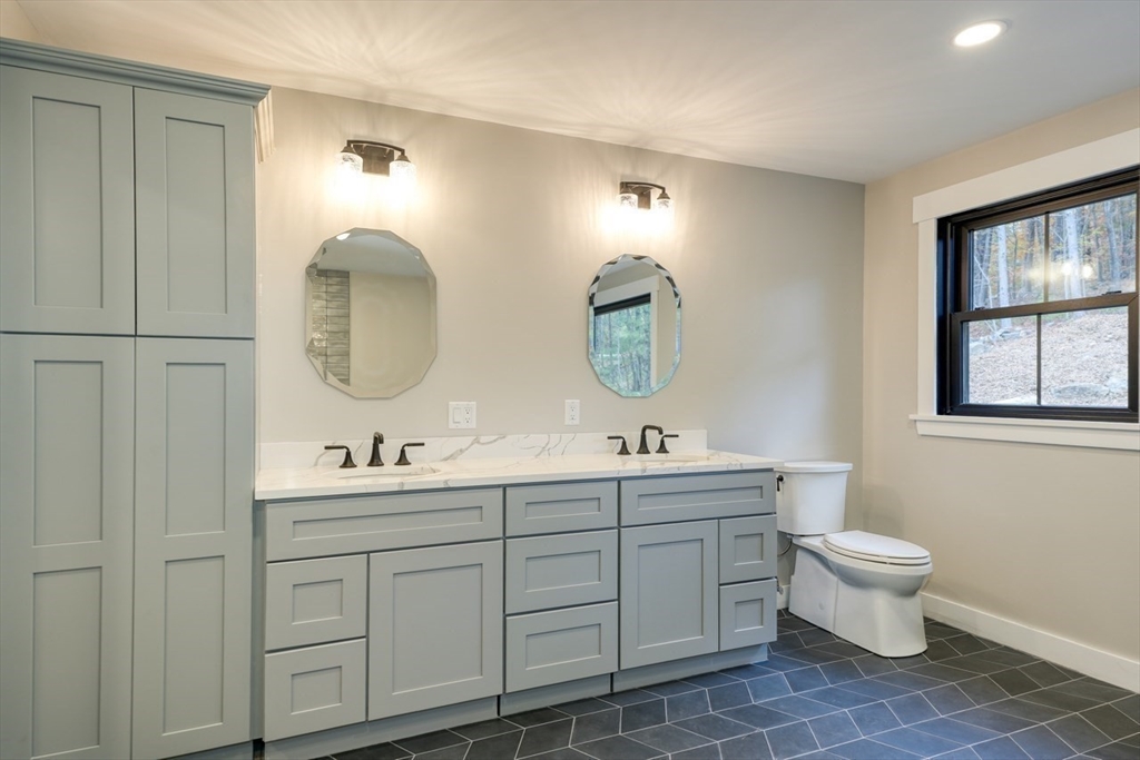 171 Randall Road Berlin, MA 01503 - Photo 26 of 41 a bathroom with 2 sink toilet and a mirror