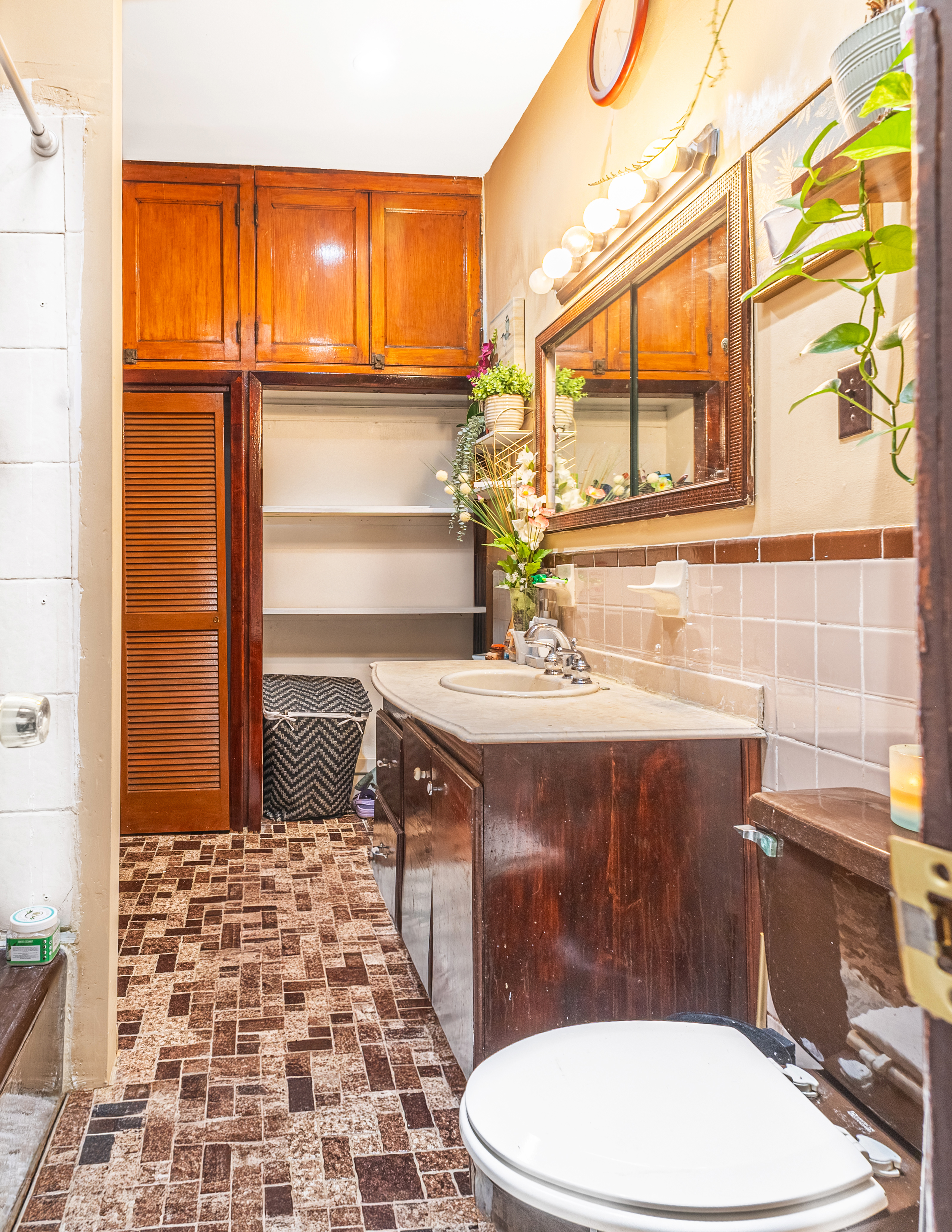 201 Maple Street Brooklyn, NY 11225 - Photo 14 of 21 a bathroom with a sink a toilet and shower